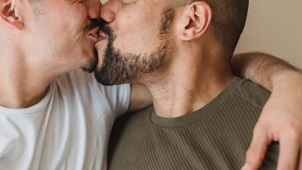 gay men kissing penis